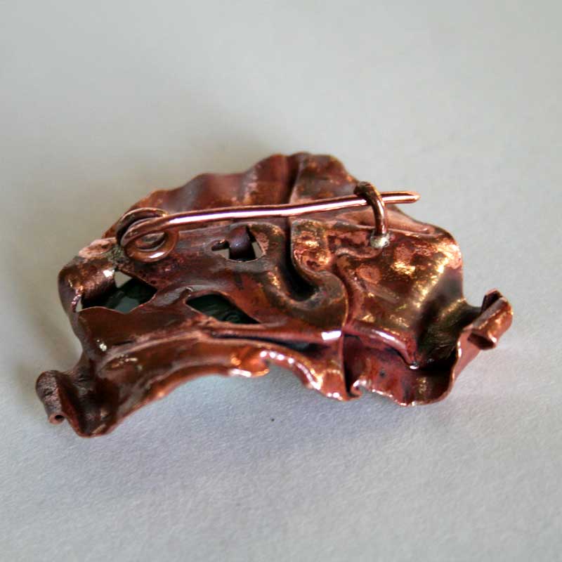 back view of Earth Embrace brooch showing handmade pin